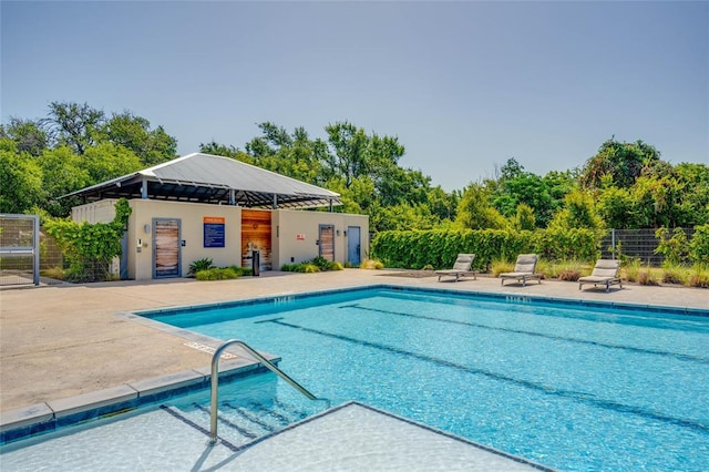 604 John Muir Trl, Leander, TX 78641 - community pool with a patio area
