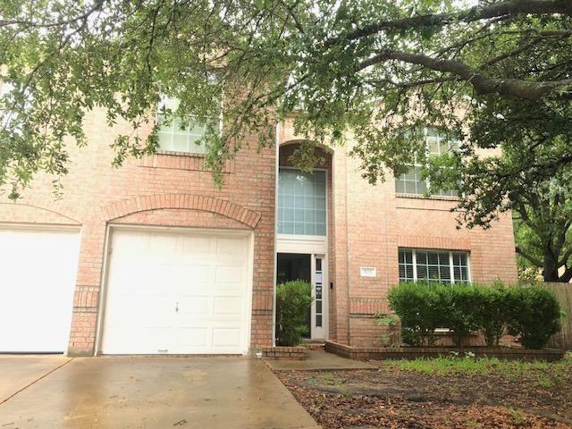 825 Barefoot Cv, Round Rock, TX 78665 - view of front of house featuring brick siding, driveway, and a garage