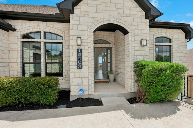 15408 Joseph Dr, Austin, TX 78734 - view of exterior entry featuring stone siding and roof with shingles