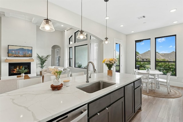 15408 Joseph Dr, Austin, TX 78734 - kitchen with open floor plan, light stone counters, light wood-type flooring, pendant lighting, and recessed lighting