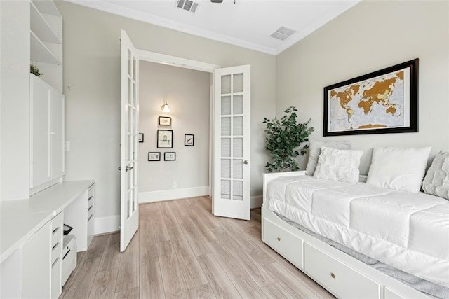 15408 Joseph Dr, Austin, TX 78734 - bedroom with french doors, crown molding, and light wood-style floors