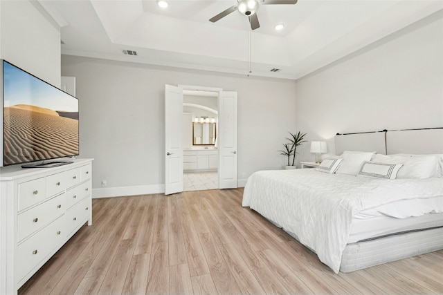 15408 Joseph Dr, Austin, TX 78734 - bedroom featuring a tray ceiling, light wood-style flooring, recessed lighting, ensuite bath, and ceiling fan