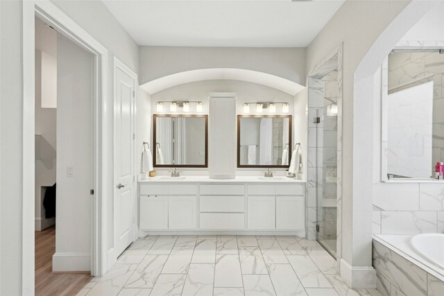 15408 Joseph Dr, Austin, TX 78734 - full bath featuring double vanity, a garden tub, marble look tile flooring, and a marble finish shower