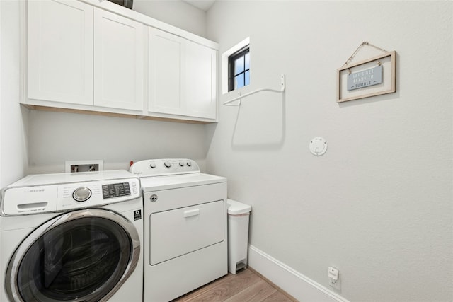 15408 Joseph Dr, Austin, TX 78734 - washroom featuring separate washer and dryer, cabinet space, and light wood-style floors