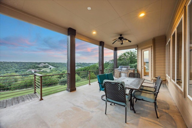 3207 Crystal Falls Pkwy, Leander, TX 78641 - patio terrace at dusk with area for grilling, a ceiling fan, and outdoor dining space