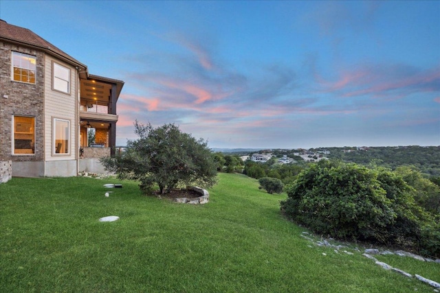 3207 Crystal Falls Pkwy, Leander, TX 78641 - yard at dusk featuring a yard and a balcony