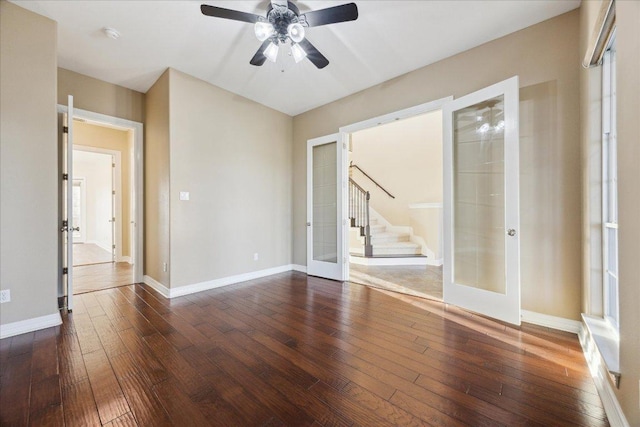 3207 Crystal Falls Pkwy, Leander, TX 78641 - unfurnished room featuring french doors, dark wood-style flooring, ceiling fan, and stairs