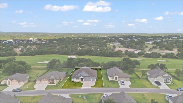 127 Tom Kite Dr, Burnet, TX 78611 - aerial view of property and surrounding area with nearby suburban area, property boundaries highlighted, and a local golf course