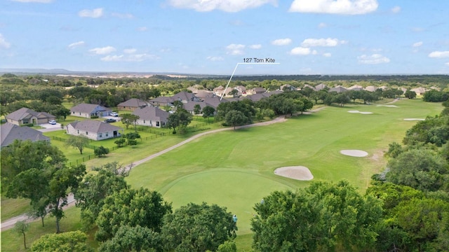 127 Tom Kite Dr, Burnet, TX 78611 - aerial perspective of suburban area with a golf club and a tree filled landscape