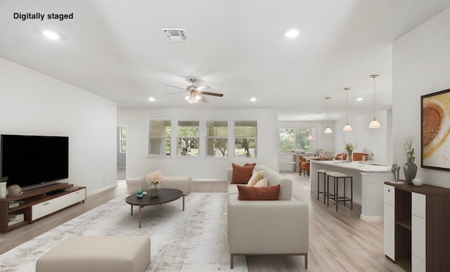 127 Tom Kite Dr, Burnet, TX 78611 - living room with recessed lighting, light wood-style flooring, and ceiling fan