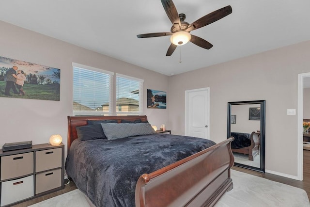 14200 James Garfield St, Manor, TX 78653 - bedroom with light wood-style flooring and a ceiling fan