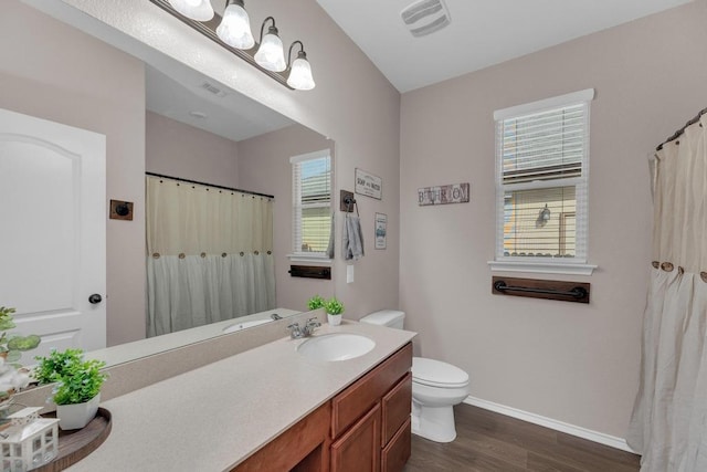 14200 James Garfield St, Manor, TX 78653 - full bath with wood finished floors, vanity, and a shower with shower curtain