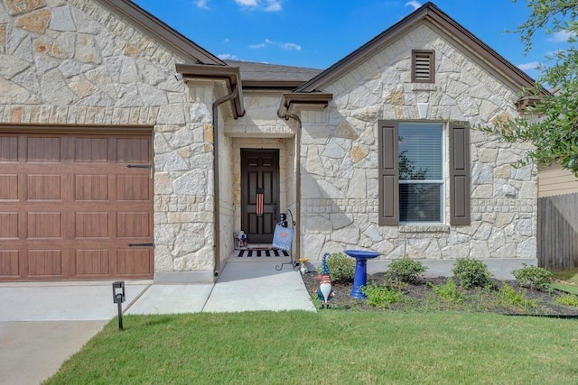 14200 James Garfield St, Manor, TX 78653 - entrance to property with stone siding and a garage