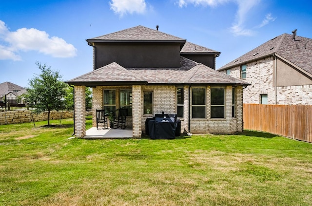 8100 Copper Prairie Bnd, Lago Vista, TX 78645 - back of house featuring a fenced backyard, a patio area, a shingled roof, and brick siding