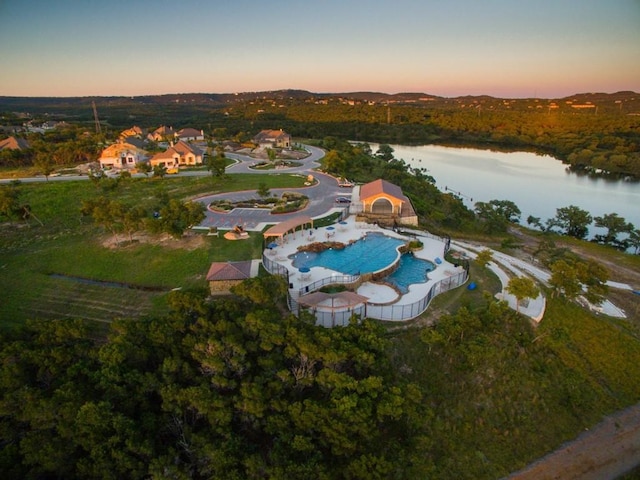 8100 Copper Prairie Bnd, Lago Vista, TX 78645 - aerial view at dusk of a water view and view of pool