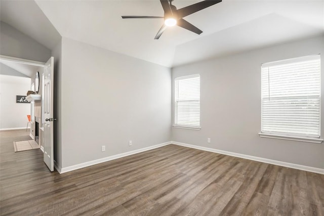 216 Watergate Way, Hutto, TX 78634 - unfurnished room featuring vaulted ceiling, a ceiling fan, and dark wood-type flooring