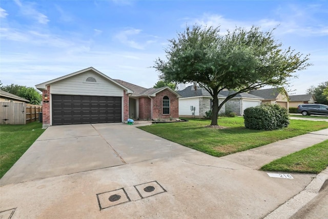 216 Watergate Way, Hutto, TX 78634 - ranch-style house with brick siding, an attached garage, and concrete driveway