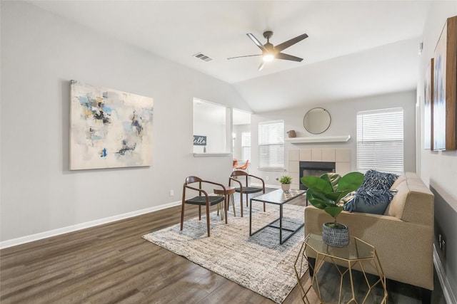 216 Watergate Way, Hutto, TX 78634 - living room featuring ceiling fan, wood finished floors, a tile fireplace, and lofted ceiling