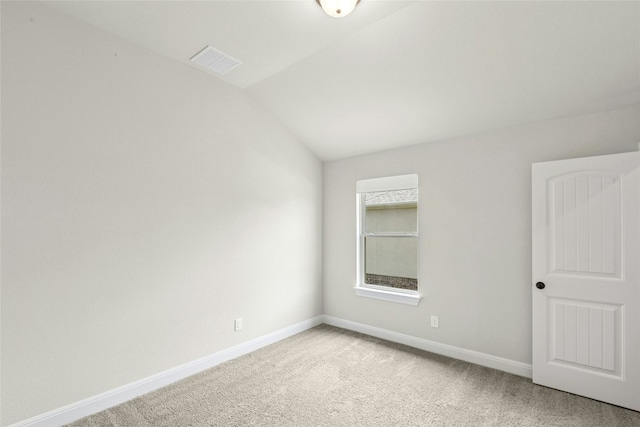 2309 Lone Spur Cv, Round Rock, TX 78665 - spare room featuring light colored carpet and lofted ceiling