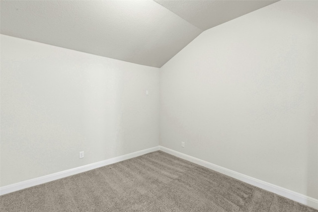 2309 Lone Spur Cv, Round Rock, TX 78665 - spare room with lofted ceiling and light carpet