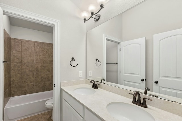 2309 Lone Spur Cv, Round Rock, TX 78665 - bathroom featuring double vanity, tile patterned floors, and shower / washtub combination