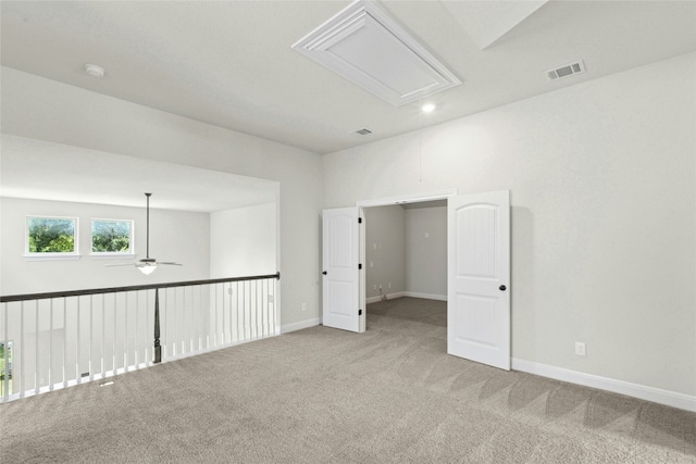 2309 Lone Spur Cv, Round Rock, TX 78665 - unfurnished room with attic access, a ceiling fan, carpet floors, and a smoke detector