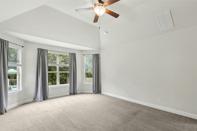2309 Lone Spur Cv, Round Rock, TX 78665 - carpeted spare room featuring vaulted ceiling, ceiling fan, and plenty of natural light