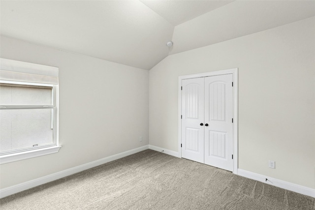 2309 Lone Spur Cv, Round Rock, TX 78665 - unfurnished bedroom with vaulted ceiling, carpet, and a closet