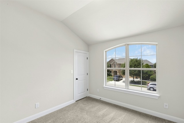 2309 Lone Spur Cv, Round Rock, TX 78665 - spare room with light colored carpet and vaulted ceiling