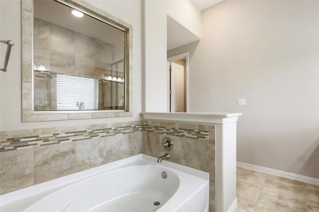 1821 Cherry Glade Trl, Georgetown, TX 78628 - bathroom featuring a bath and baseboards