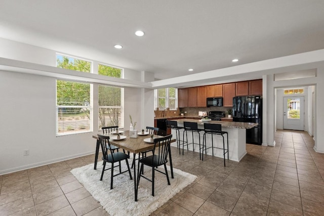 1267 Sanders, Kyle, TX 78640 - dining room featuring recessed lighting and light tile patterned floors