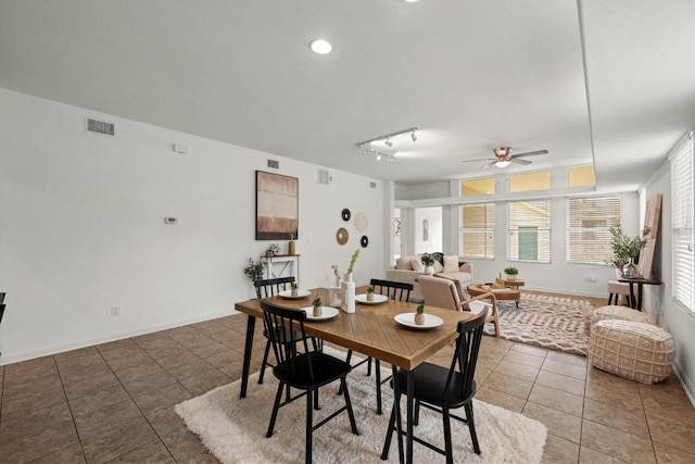 1267 Sanders, Kyle, TX 78640 - tiled dining room with ceiling fan and rail lighting