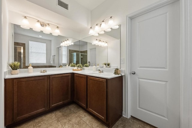1267 Sanders, Kyle, TX 78640 - full bath featuring a stall shower, double vanity, and tile patterned floors