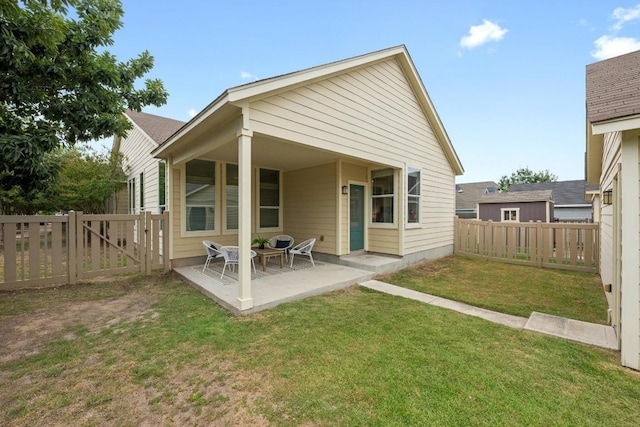 1267 Sanders, Kyle, TX 78640 - rear view of house featuring a fenced backyard, a patio, and a gate