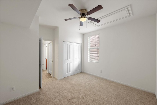 1267 Sanders, Kyle, TX 78640 - unfurnished bedroom featuring attic access, light colored carpet, a closet, and ceiling fan