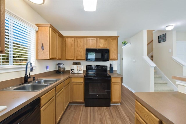 401 Buttercup Creek Blvd Unit 1904, Cedar Park, TX 78613 - kitchen with black appliances and light wood-style flooring