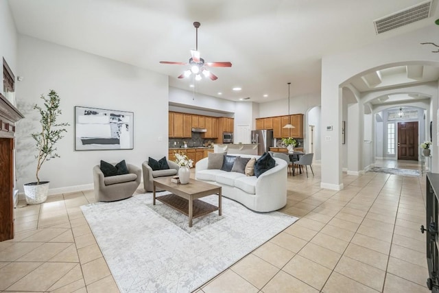 112 Mcbride Ln, Cedar Park, TX 78613 - living area with ceiling fan, light tile patterned flooring, arched walkways, and recessed lighting