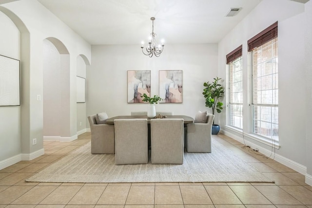 112 Mcbride Ln, Cedar Park, TX 78613 - dining space featuring light tile patterned floors, healthy amount of natural light, and a chandelier