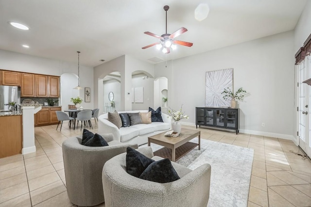 112 Mcbride Ln, Cedar Park, TX 78613 - living area with arched walkways, light tile patterned flooring, a ceiling fan, and recessed lighting