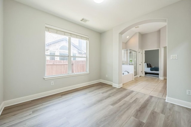 112 Mcbride Ln, Cedar Park, TX 78613 - empty room featuring arched walkways and wood finished floors