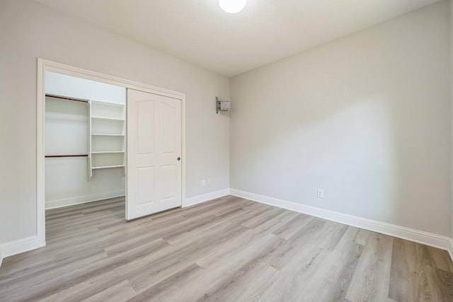 112 Mcbride Ln, Cedar Park, TX 78613 - unfurnished bedroom featuring wood finished floors and a closet