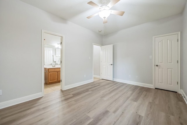 112 Mcbride Ln, Cedar Park, TX 78613 - unfurnished bedroom with light wood finished floors, connected bathroom, and a ceiling fan