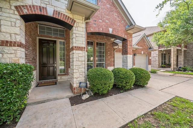 112 Mcbride Ln, Cedar Park, TX 78613 - entrance to property with brick siding, a garage, and stone siding