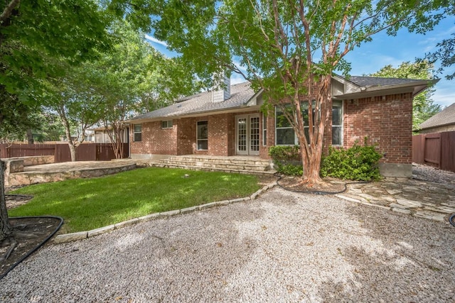 112 Mcbride Ln, Cedar Park, TX 78613 - back of house with brick siding, a fenced backyard, a chimney, and a patio