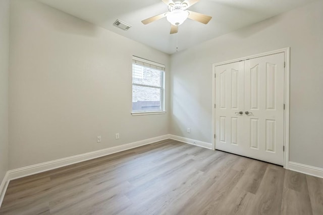112 Mcbride Ln, Cedar Park, TX 78613 - unfurnished bedroom featuring wood finished floors, a closet, and ceiling fan