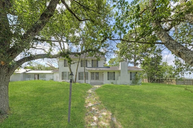 3508 Moulton Rd, Gonzales, TX 78629 - back of house with stucco siding and a chimney