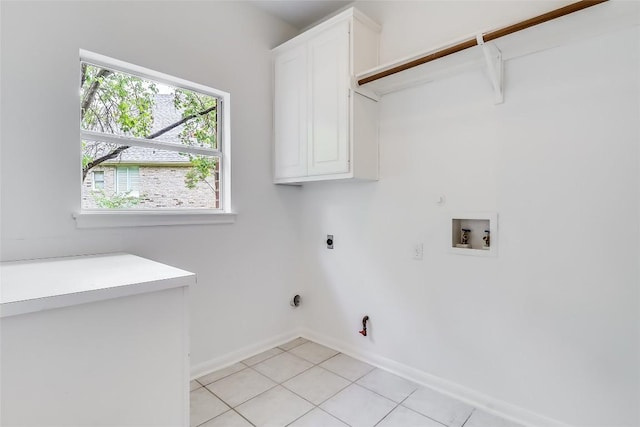 12608 Chittim Cir, Austin, TX 78732 - laundry area with hookup for a gas dryer, cabinet space, hookup for an electric dryer, and hookup for a washing machine