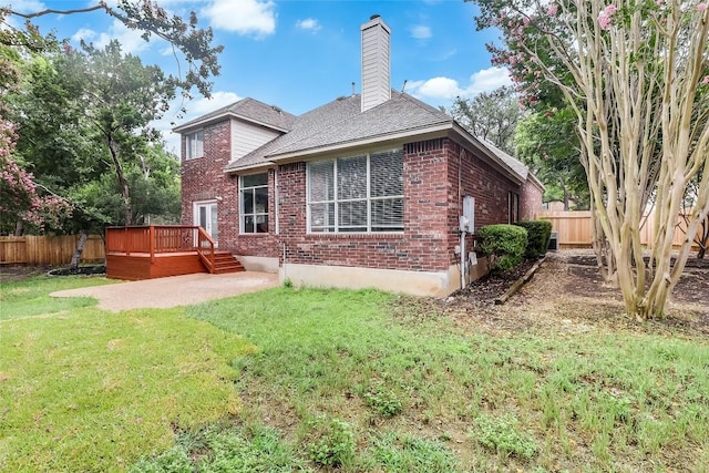 12608 Chittim Cir, Austin, TX 78732 - back of property with brick siding, a wooden deck, a fenced backyard, and a chimney
