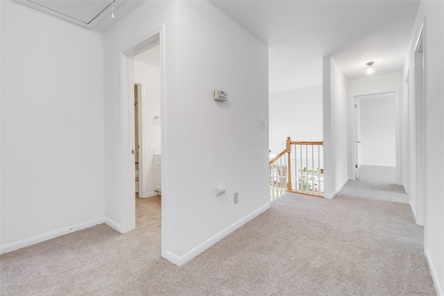 12608 Chittim Cir, Austin, TX 78732 - corridor with light carpet, attic access, and an upstairs landing