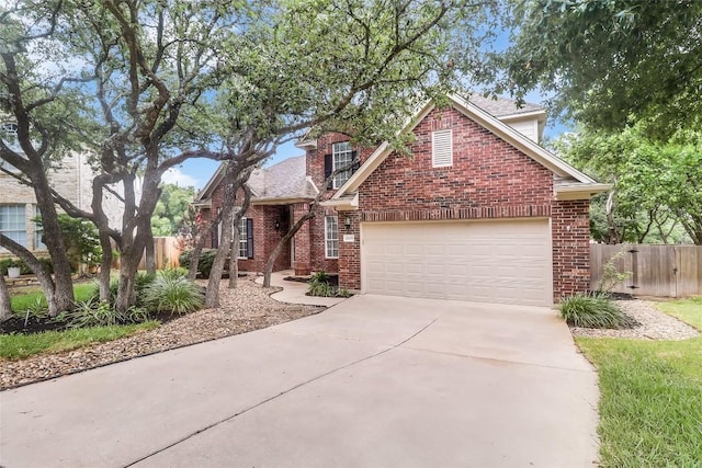 12608 Chittim Cir, Austin, TX 78732 - traditional-style house featuring brick siding, concrete driveway, an attached garage, and a shingled roof